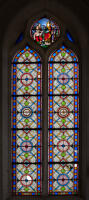 Verrière (baie 1) : Symboles du Christ ; Saint évêque guérissant un paralytique